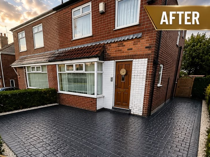 After: the same house with a charcoal pattern-imprinted concrete driveway running kerb to door, edged with white cobbles and wet-sealed to a sheen.